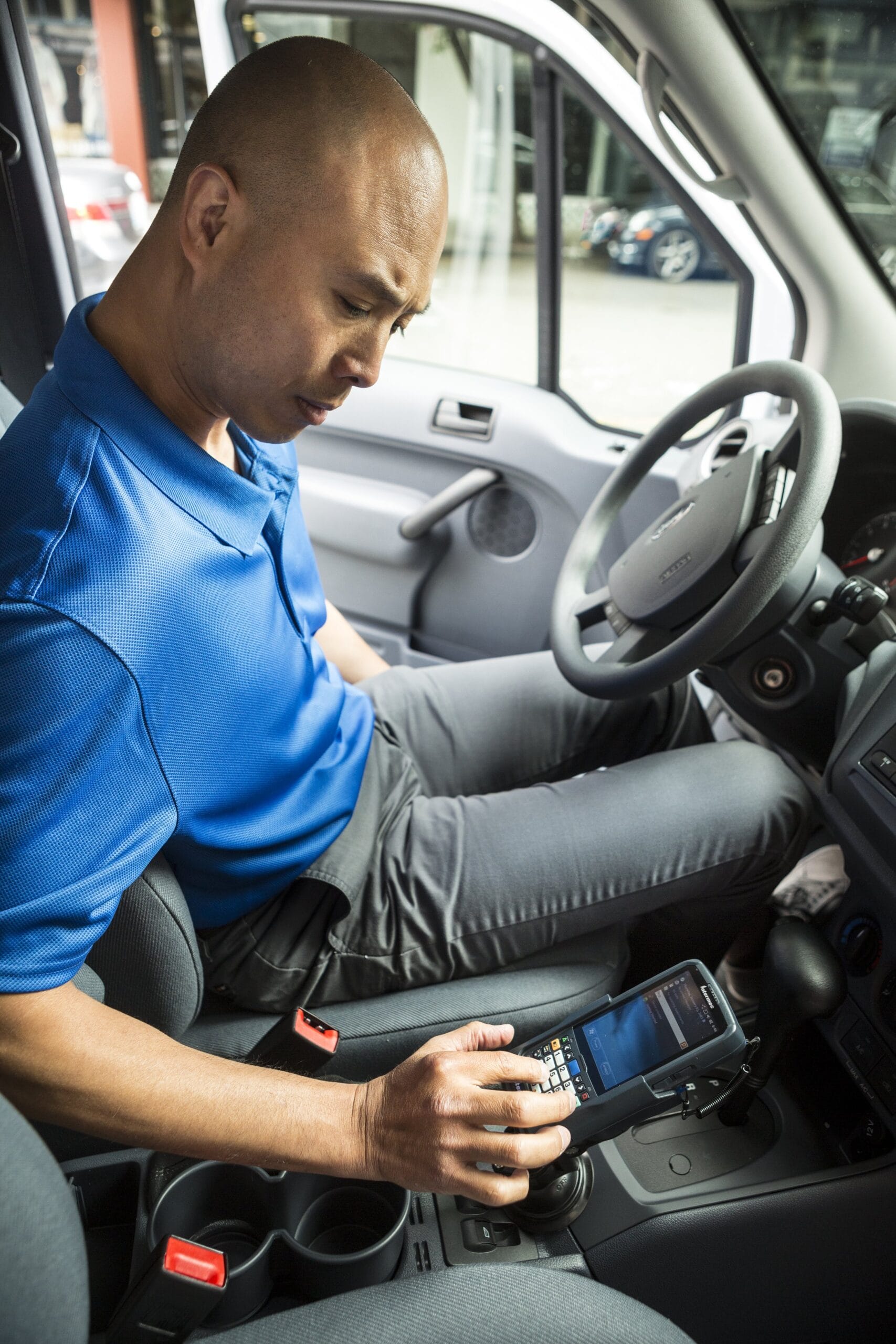 A man using a Intermec mobile computer