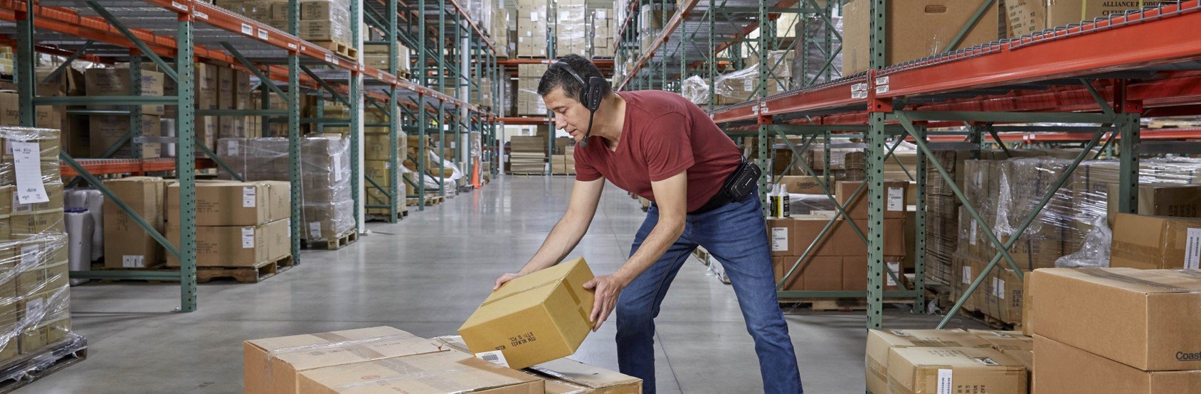 A warehouse worker using a Honeywell voice automated headset