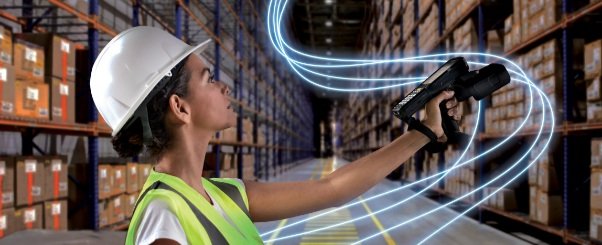 A woman scanning in a warehouse
