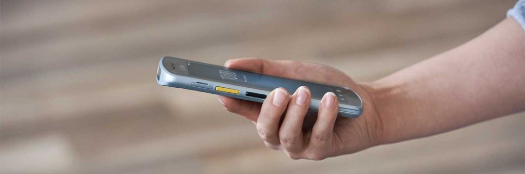 Someone holding a mobile computer in their hand