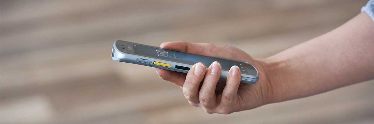 Someone holding a mobile computer in their hand