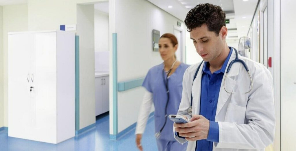 A healthcare worker using a mobile computer in a hospital