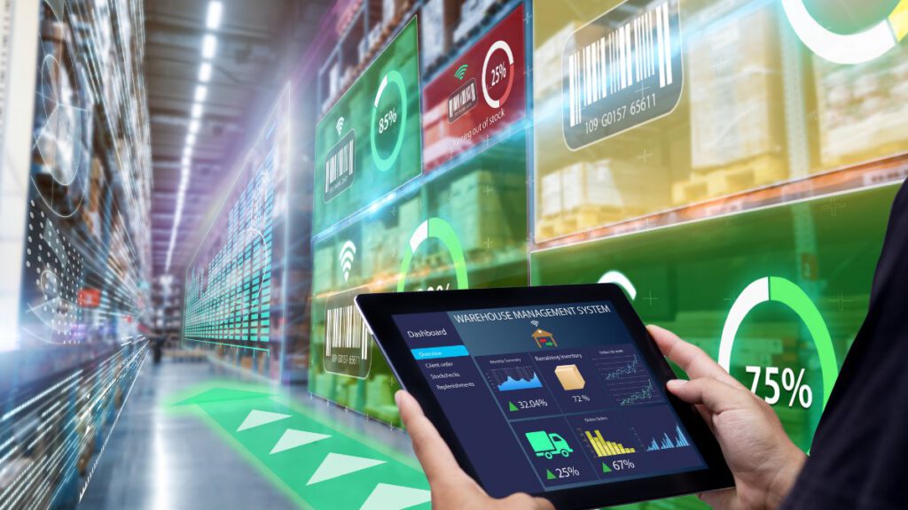 A tablet displaying 'Warehouse Management System' being used to map out a warehouse