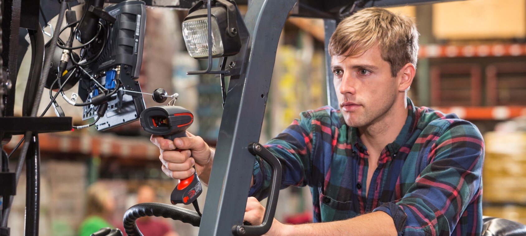 Someone using a barcode scanner from a forklift