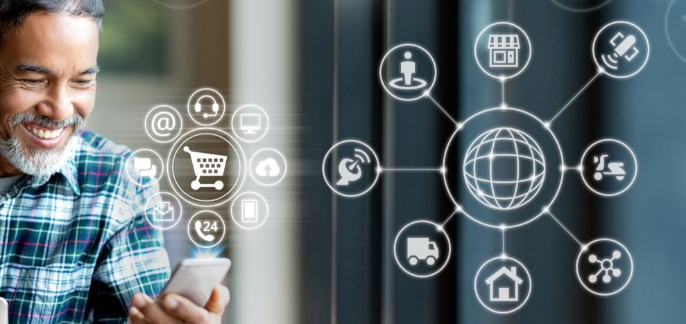 A man looking at his phone with shopping icons overlayed