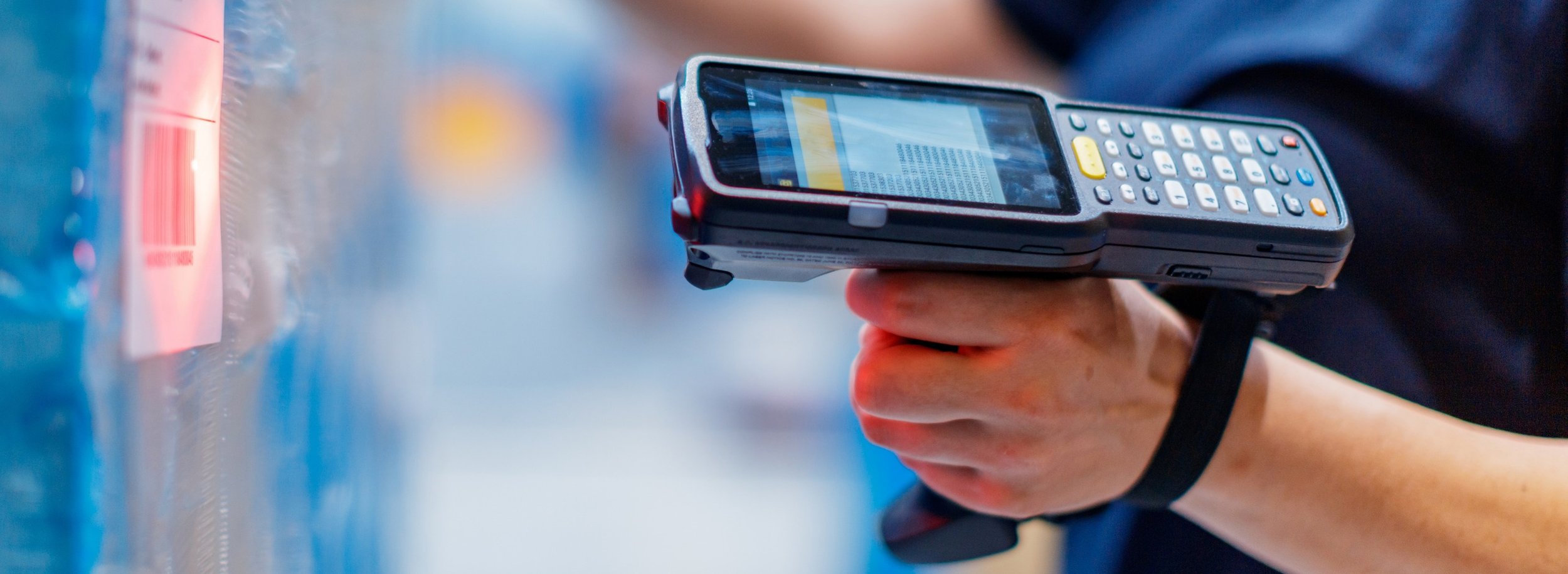 Someone holding a handheld barcode scanner