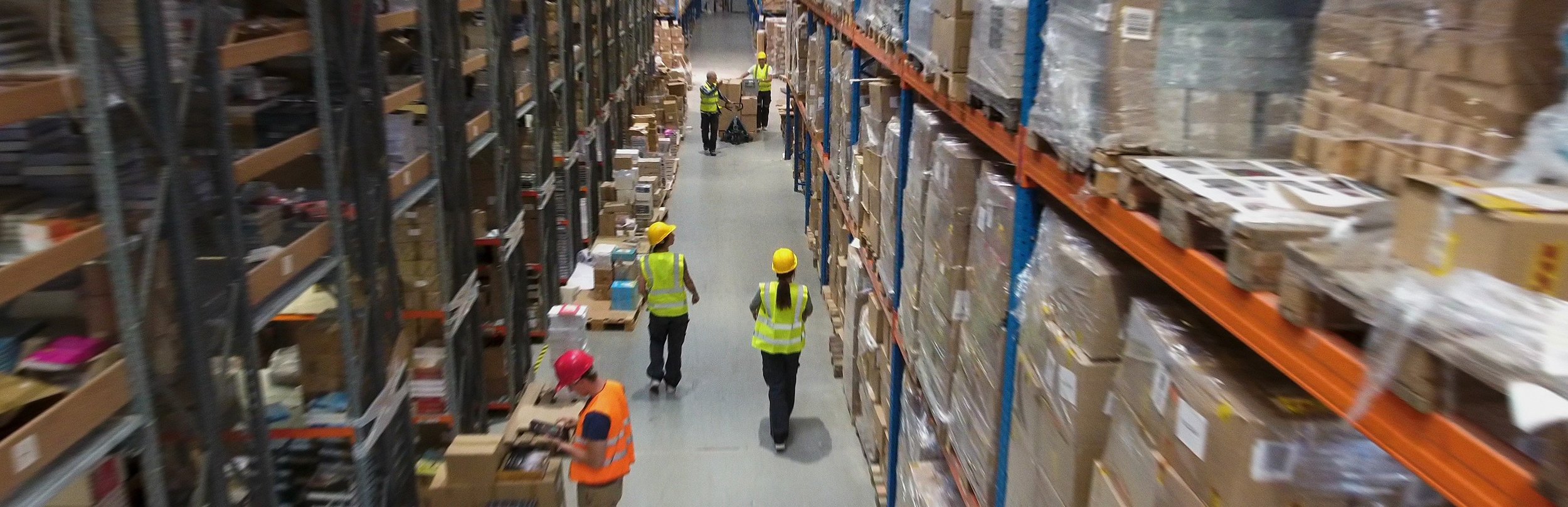 A group of workers in a warehouse
