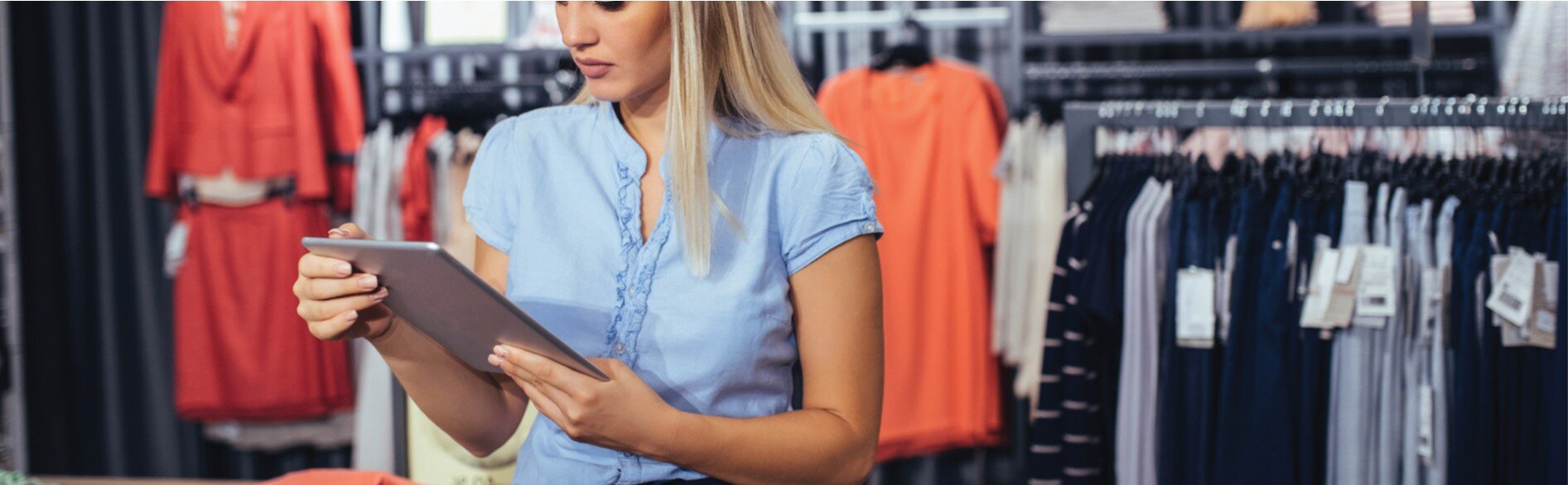 A woman with a tablet in a retail store