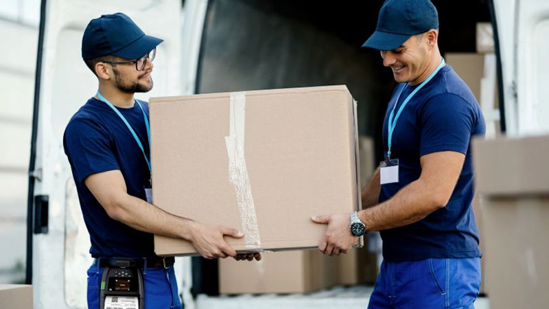 Two men delivering a package
