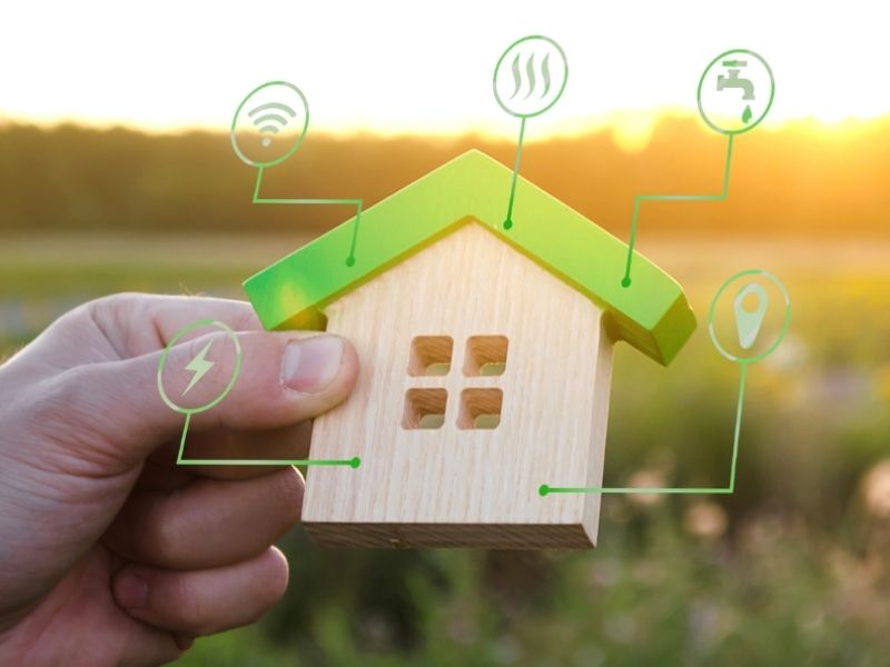 IoT connected house, shown with wooden model and icons
