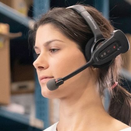 A woman using a voice directed headset