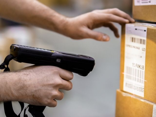 Someone using a barcode scanner