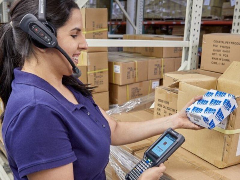 A woman in a voice directed headset
